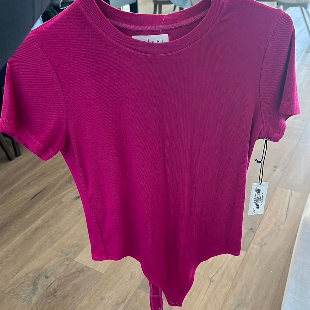 M Ribbed pink short sleeve body suit by velvet by Graham & spencer. Never worn